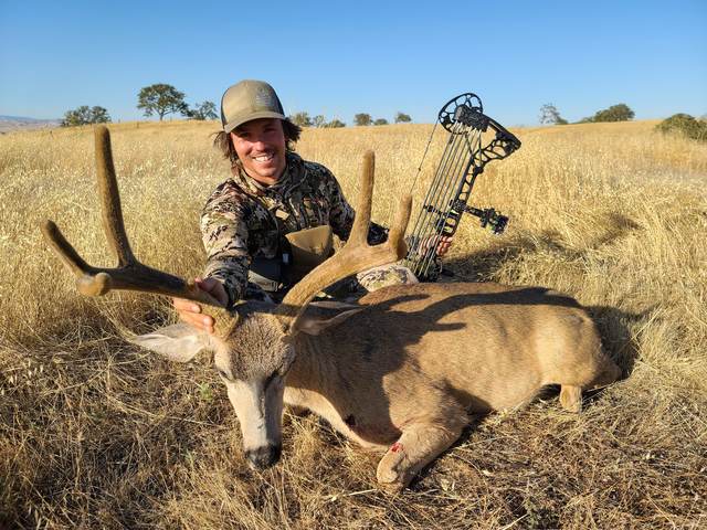 Hunter with a trophy Central Coast blacktail buck