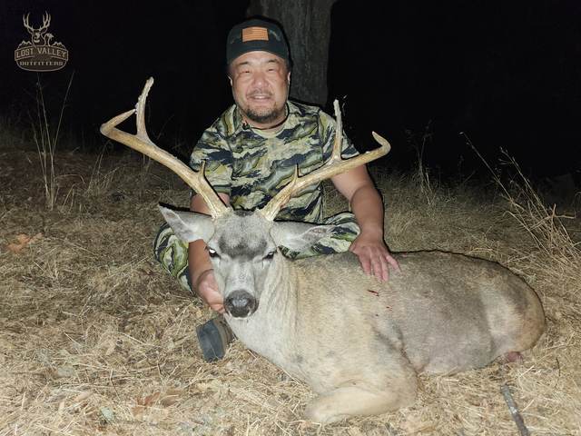 Hunter with a trophy Central Coast blacktail buck