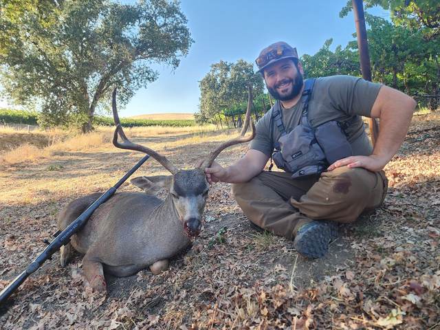 Hunter with a trophy Central Coast blacktail buck