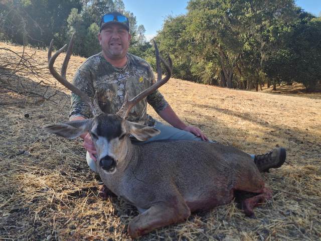 Hunter with a trophy Central Coast blacktail buck