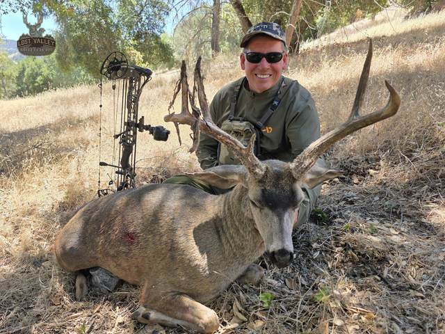 Hunter with a trophy Central Coast blacktail buck