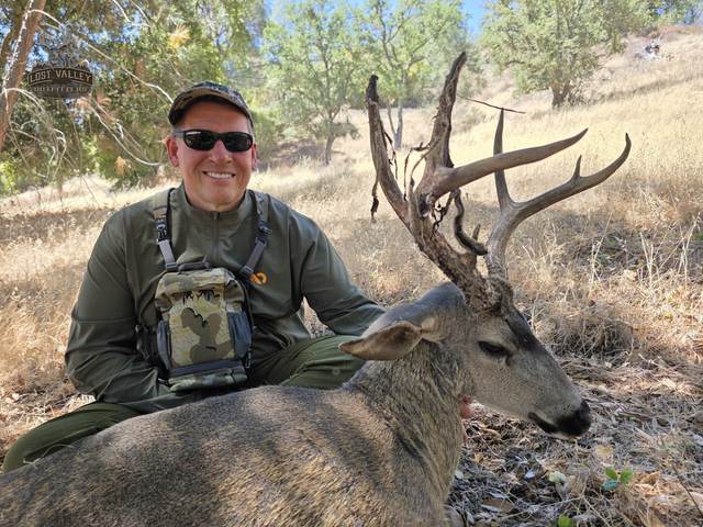 Hunter with a trophy Central Coast blacktail buck