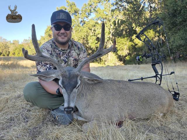 Hunter with a trophy Central Coast blacktail buck