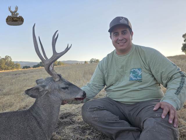 Hunter with a trophy Central Coast blacktail buck