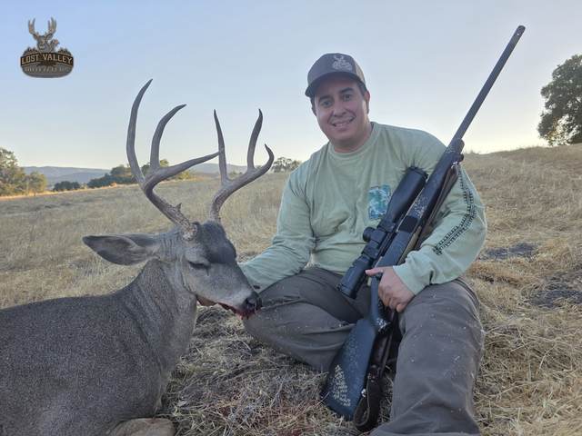 Hunter with a trophy Central Coast blacktail buck