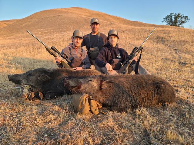 Hunter with a Central Coast wild pig taken on a guided rifle hunt