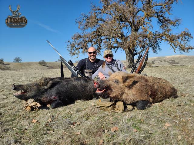 Hunter with a Central Coast wild pig taken on a guided rifle hunt