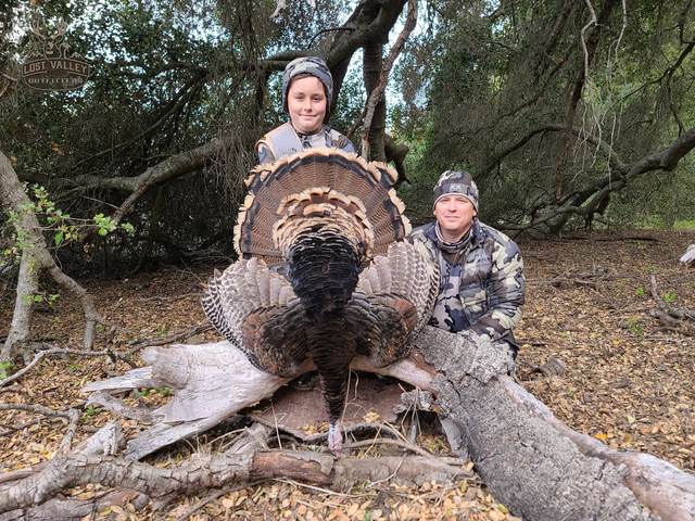 Hunter with a Rio Grande tom taken in the oaks