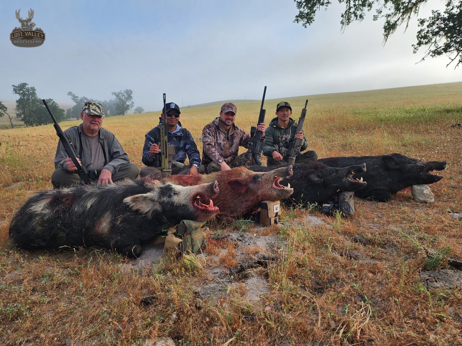 Group of rifle hunters with a morning of Central Coast wild pigs